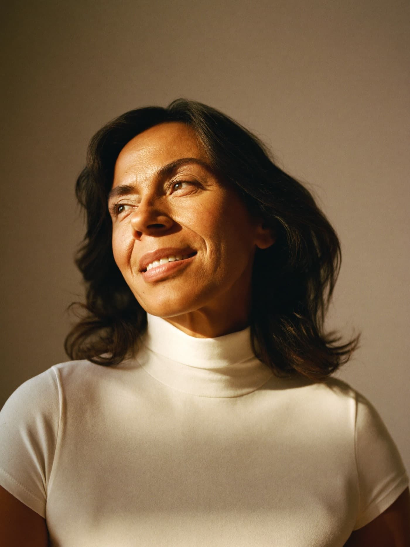 Woman in her 50s in soft window light